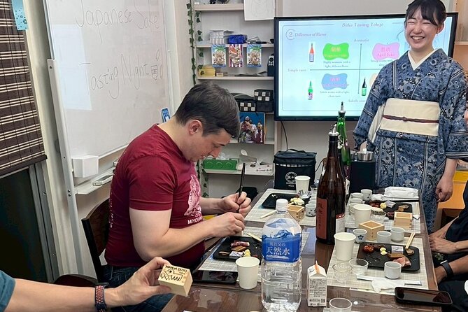 Japanese Sake Tasting and Masu Crafting Experience in Tokyo - Decorating your masu with Japanese brush pens: a souvenir with meaning