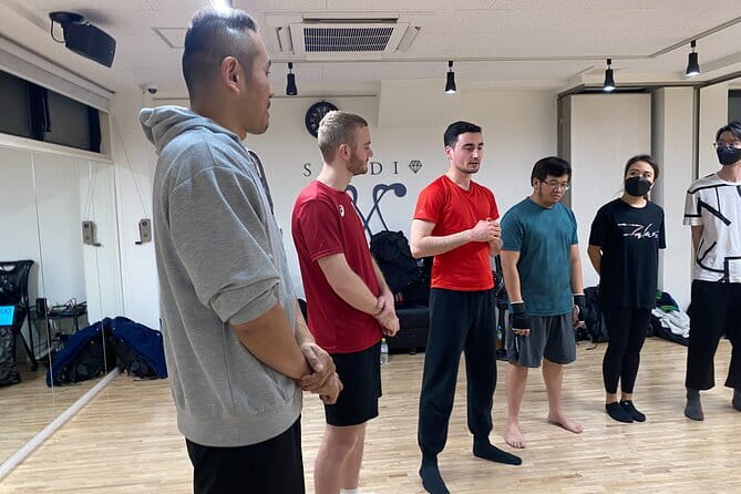 Kickboxing & Body Training with EX-Pro Fighter - Your 1-Hour Session Breakdown: Safety, Stretching, Pads, and Defense