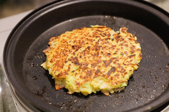 Okonomiyaki making experience~Japanese popular food - Meat vs Seafood: Choosing Your Okonomiyaki Style