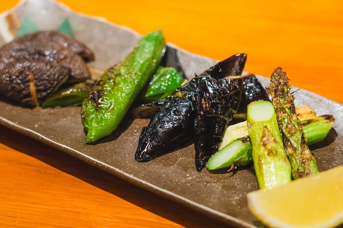 Tokyo Ginza Authentic Food Tour (Izakaya Hopping by local guide) - Stop 2: Ginza Mitsukoshi landmark photo moment