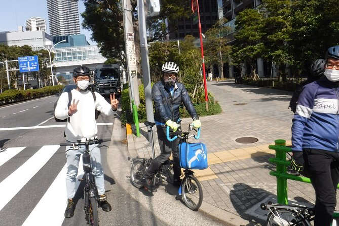 Tokyo Private Sightseeing Tour by Bike with Water Bus - Tsukudakobashi Bridge: old shoreline views with modern Tokyo behind it