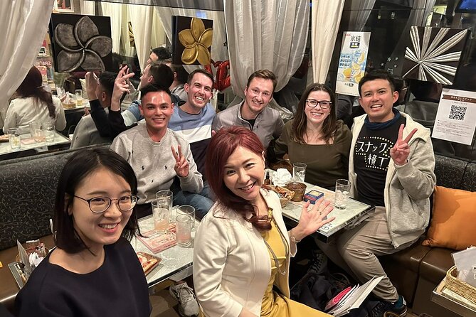 Tokyo Shinbashi Night Tour: Local Guide & Drinks at Snack Bars - Stop 2: Karasumori-jinja and simple praying etiquette