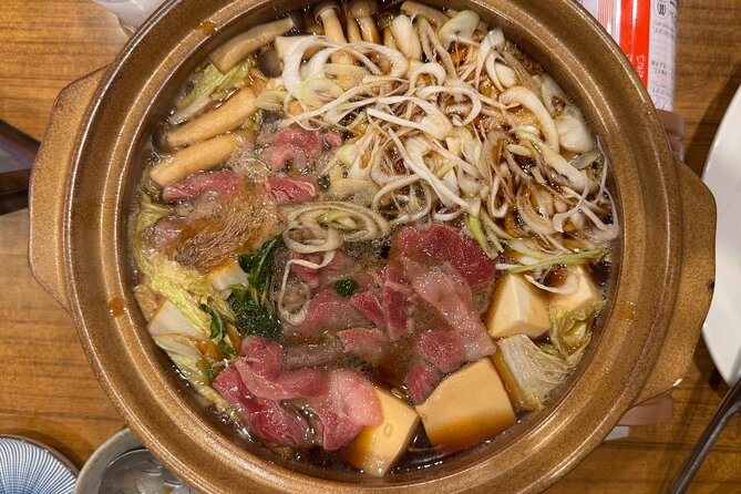 Tokyo Shinjuku Bar Hopping –Wagyu , Ramen & 7 Dishes - Stop 2: Wagyu Sukiyaki + Ramen at MIRAIZAKA Shinjuku‐Higashiguchi