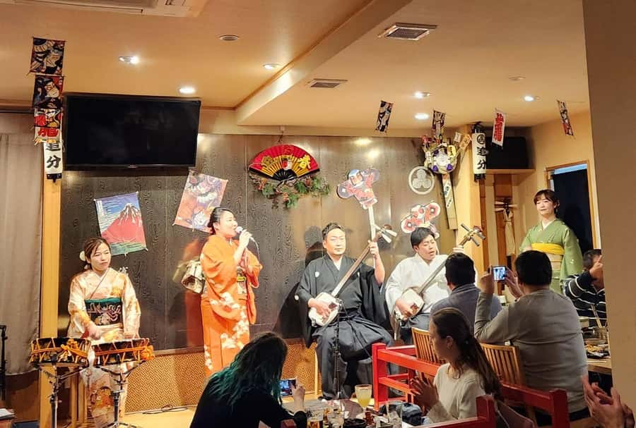 Tokyo: Traditional Asakusa Music Show with Dinner - From temple streets to an izakaya: where dinner becomes part of the show