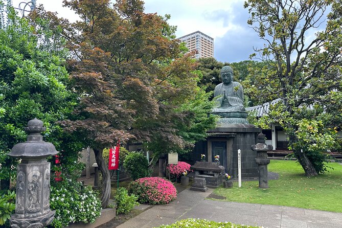 Tokyo : Yanaka and Nezu-Old Traditional Town Cultural Experience - Pass the 100-year Himalayan cedar: a small roadside marker with weight