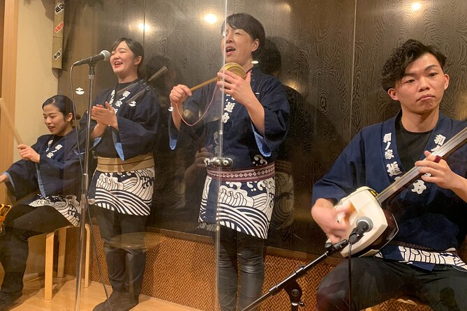 Tsugaru shamisen performance over traditional dinner - Dinner details: included meal, welcome drink, and real accommodation